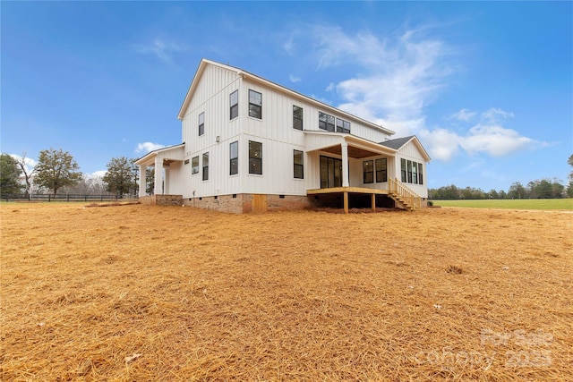4095 Kingfisher Dr, York, SC 29745 - back of property with fence, board and batten siding, a sunroom, and crawl space