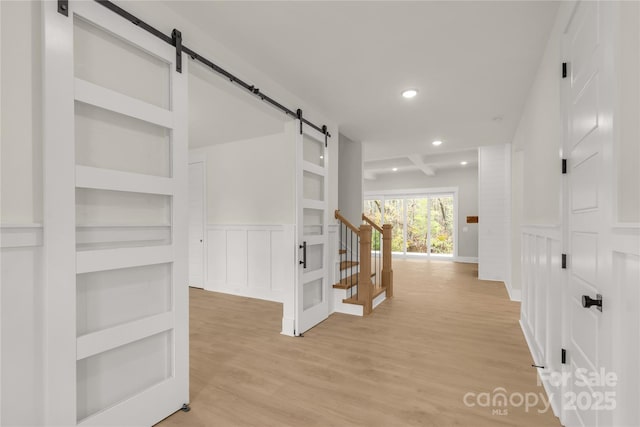 4095 Kingfisher Dr, York, SC 29745 - corridor featuring light wood-style floors, wainscoting, recessed lighting, and a barn door