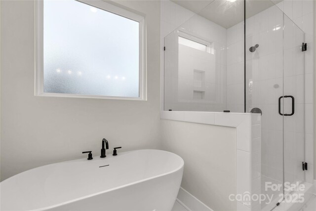4095 Kingfisher Dr, York, SC 29745 - bathroom featuring a freestanding tub and a shower stall