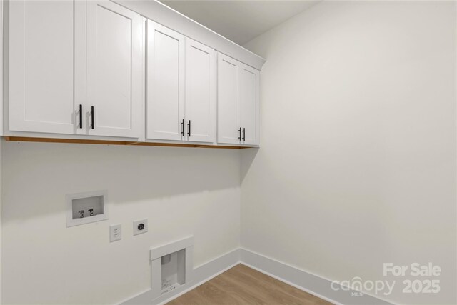 4095 Kingfisher Dr, York, SC 29745 - laundry area featuring cabinet space, electric dryer hookup, baseboards, and hookup for a washing machine