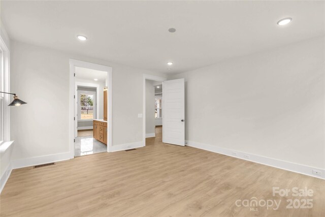 4095 Kingfisher Dr, York, SC 29745 - unfurnished bedroom with visible vents, baseboards, connected bathroom, recessed lighting, and light wood-style flooring