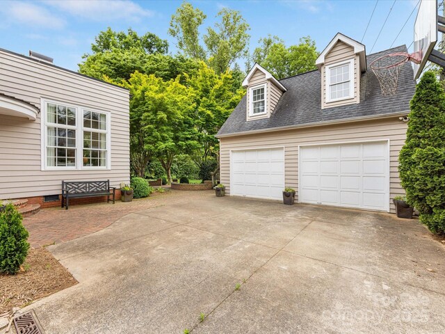 garage featuring driveway