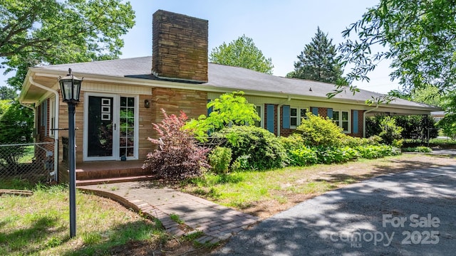 3418 Sulphur Springs Rd NE, Hickory, NC 28601 - ranch-style house featuring a chimney, fence, and driveway