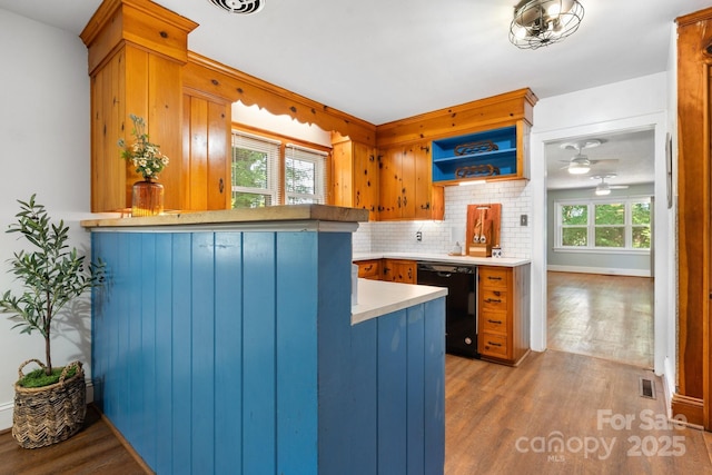 3418 Sulphur Springs Rd NE, Hickory, NC 28601 - kitchen with dishwasher, plenty of natural light, wood finished floors, and tasteful backsplash