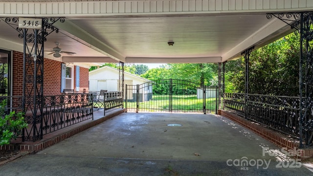 3418 Sulphur Springs Rd NE, Hickory, NC 28601 - view of patio featuring an outbuilding, ceiling fan, a gate, and an attached carport