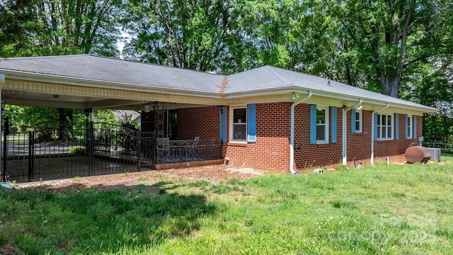 3418 Sulphur Springs Rd NE, Hickory, NC 28601 - view of side of home with brick siding and a carport