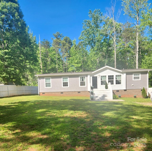 2025 Kisatchie Dr, Hickory Grove, SC 29717 - back of property with crawl space and view of scattered trees