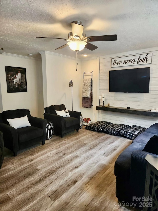 2025 Kisatchie Dr, Hickory Grove, SC 29717 - living area with wood finished floors, a textured ceiling, ceiling fan, and crown molding