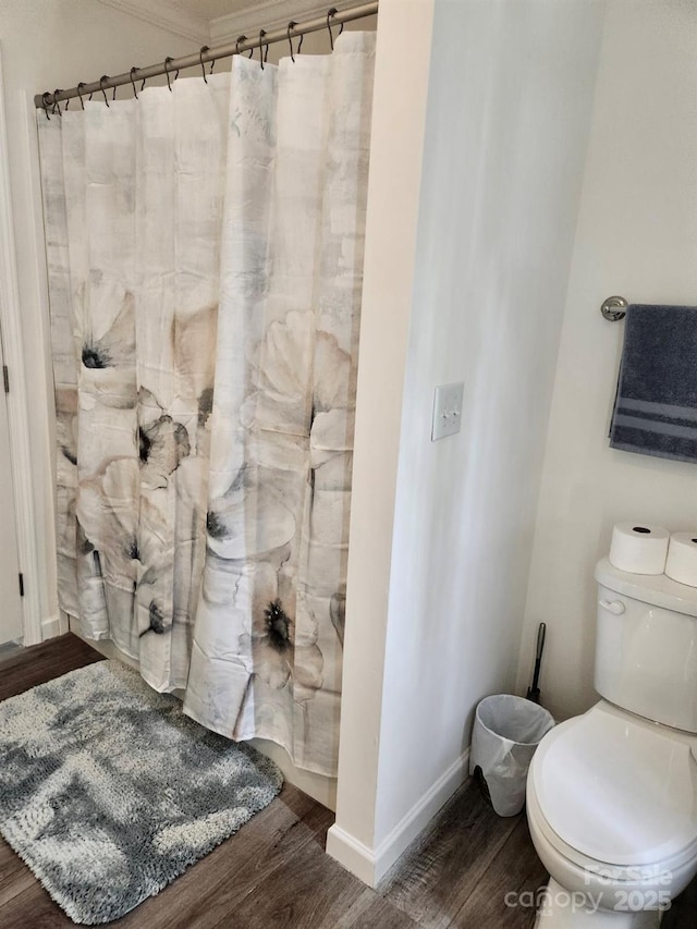 2025 Kisatchie Dr, Hickory Grove, SC 29717 - full bathroom featuring wood finished floors, toilet, crown molding, baseboards, and curtained shower