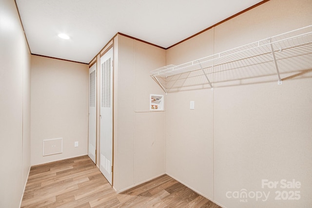 2191 Deep Gap Rd, Flat Rock, NC 28731 - laundry room with light wood-type flooring, hookup for a washing machine, crown molding, and recessed lighting
