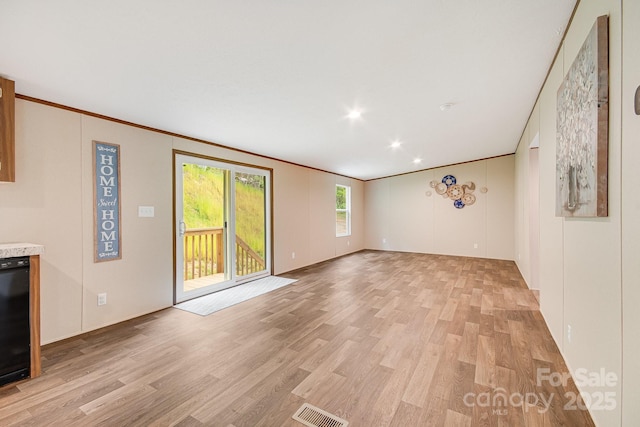 2191 Deep Gap Rd, Flat Rock, NC 28731 - unfurnished living room featuring light wood finished floors, crown molding, and recessed lighting