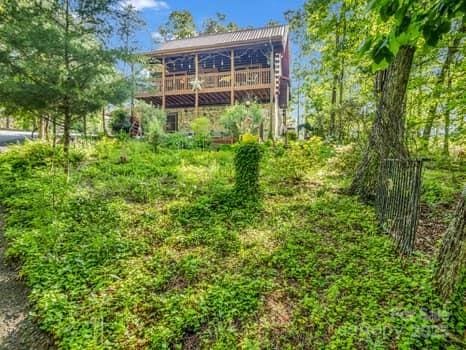 back of property with a wooden deck