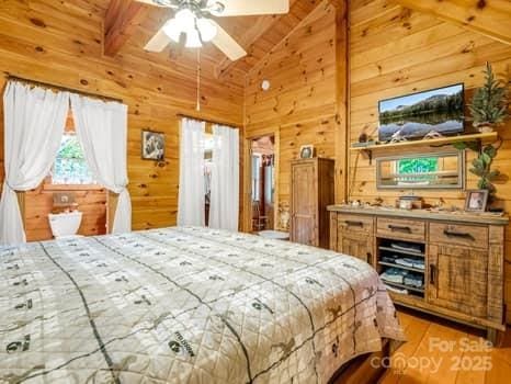 323 Acorn Ln Unit 6, 5, Rutherfordton, NC 28139 - bedroom with wooden walls, light wood-type flooring, and wood ceiling