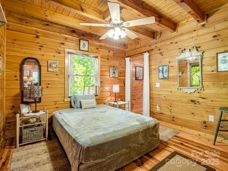 323 Acorn Ln Unit 6, 5, Rutherfordton, NC 28139 - bedroom featuring wooden ceiling, wood finished floors, beam ceiling, and wooden walls