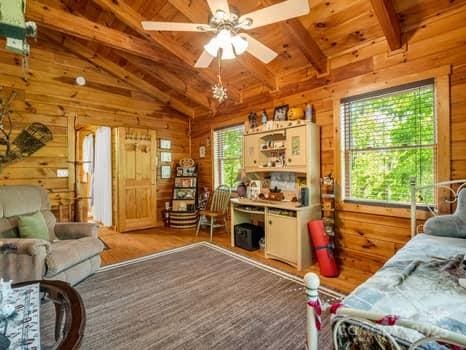 323 Acorn Ln Unit 6, 5, Rutherfordton, NC 28139 - living room featuring wooden walls, a ceiling fan, wood ceiling, and wood finished floors