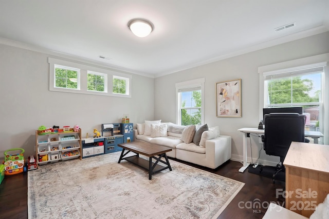living room with crown molding, dark wood-style floors, and visible vents