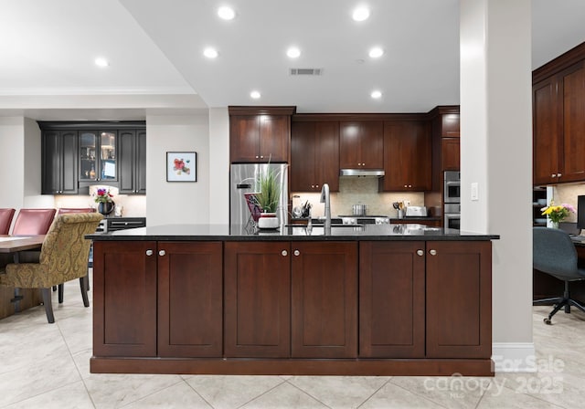 435 S Tryon St Unit 601, Charlotte, NC 28202 - kitchen with dark countertops, visible vents, appliances with stainless steel finishes, and a sink