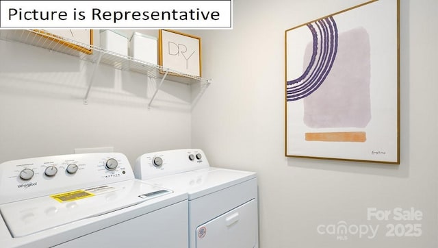 laundry room with washer and dryer and laundry area