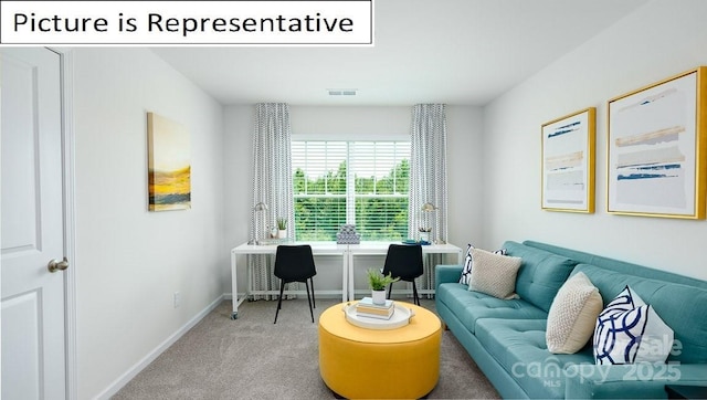 sitting room with carpet flooring, baseboards, and visible vents