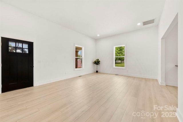entrance foyer featuring visible vents, recessed lighting, light wood-style flooring, and baseboards