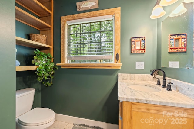102 Altamahaw Ave, Black Mountain, NC 28711 - half bathroom with vanity, toilet, tile patterned floors, and baseboards