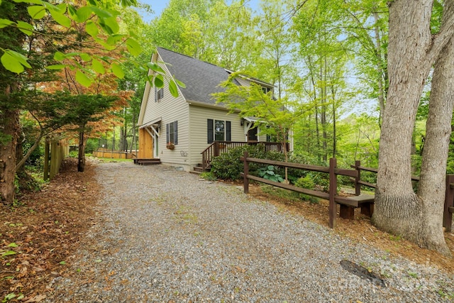 102 Altamahaw Ave, Black Mountain, NC 28711 - view of side of home featuring roof with shingles, a wooden deck, and driveway