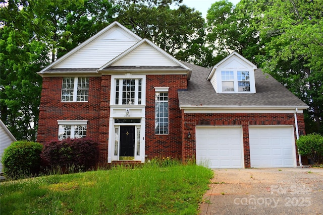 view of front of house featuring driveway, an attached garage, brick siding, and roof with shingles