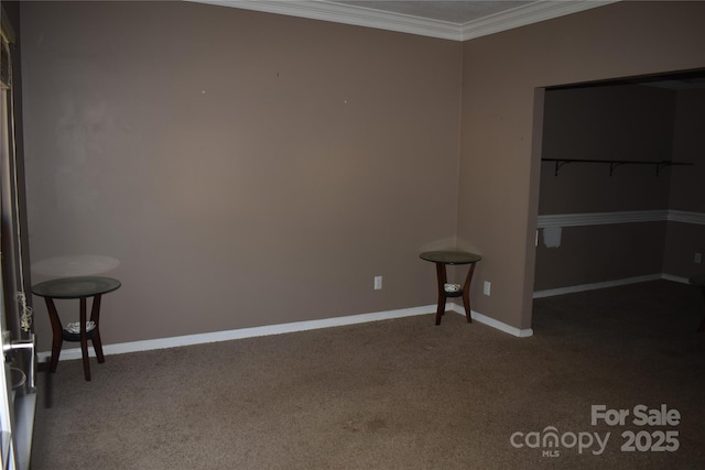 unfurnished bedroom with carpet, ornamental molding, and baseboards