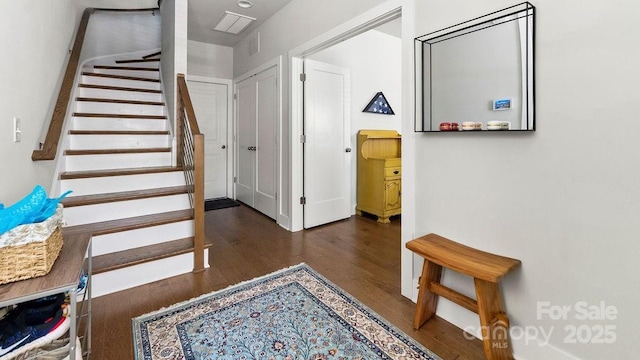 entrance foyer featuring wood finished floors and stairway