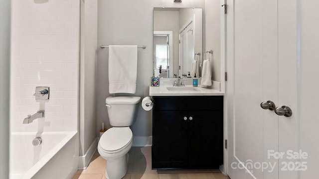 full bath featuring vanity, toilet, tile patterned floors, shower / bath combination, and baseboards
