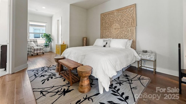 bedroom featuring baseboards, recessed lighting, and wood-type flooring