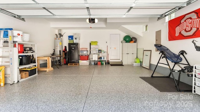 garage featuring a garage door opener and electric water heater