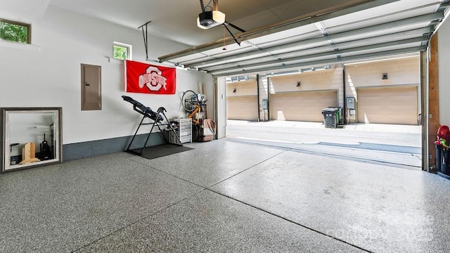 garage featuring a garage door opener and electric panel