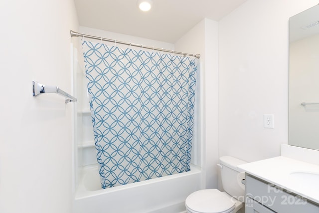bathroom featuring shower / tub combo, toilet, visible vents, and vanity