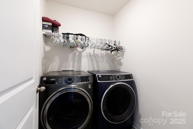 washroom with laundry area and washer and dryer
