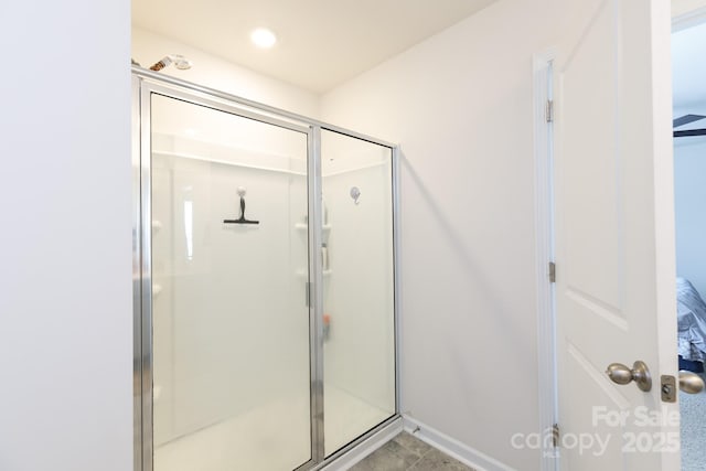bathroom with a shower stall