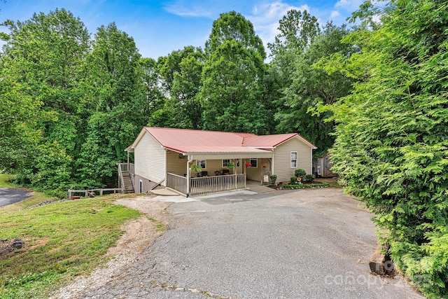 3690 Birchwood Ln, Denver, NC 28037 - view of front of property with a porch, metal roof, and driveway