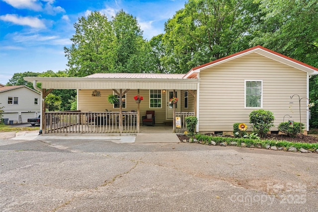 3690 Birchwood Ln, Denver, NC 28037 - view of front of property with a porch, metal roof, and crawl space