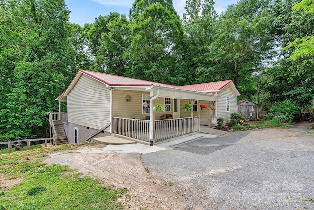 3690 Birchwood Ln, Denver, NC 28037 - view of front of home with a porch, metal roof, stairway, and crawl space