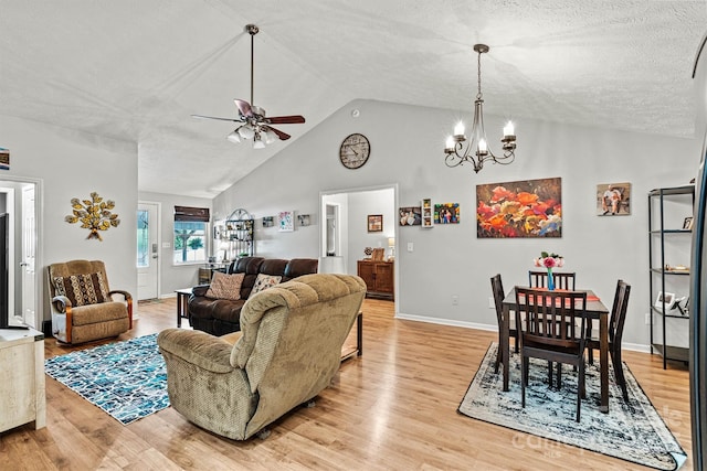 3690 Birchwood Ln, Denver, NC 28037 - living room with vaulted ceiling, light wood-style floors, a chandelier, ceiling fan, and a textured ceiling