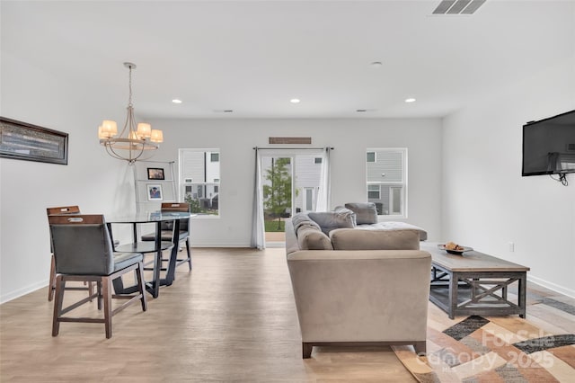 12110 Chesapeake Mallard Dr, Charlotte, NC 28262 - living area with a chandelier, light wood finished floors, baseboards, and recessed lighting