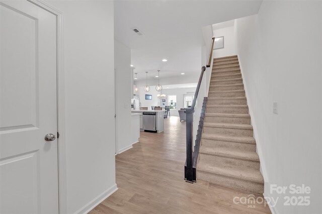 12110 Chesapeake Mallard Dr, Charlotte, NC 28262 - staircase featuring wood finished floors, recessed lighting, and baseboards