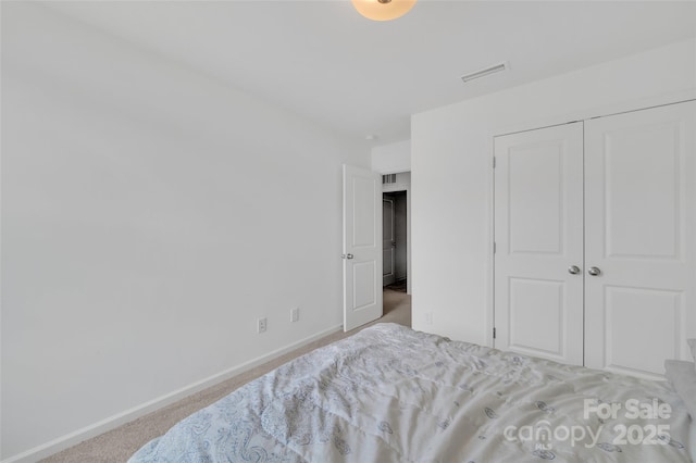 12110 Chesapeake Mallard Dr, Charlotte, NC 28262 - carpeted bedroom with baseboards and a closet