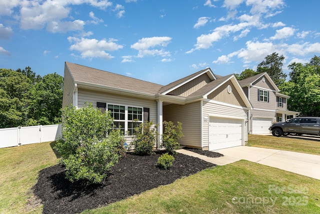 view of front facade with fence, an attached garage, board and batten siding, a front yard, and concrete driveway