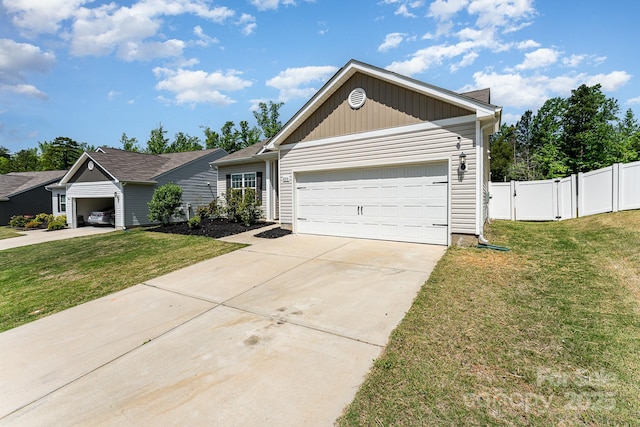 ranch-style home featuring board and batten siding, driveway, fence, a front lawn, and an attached garage