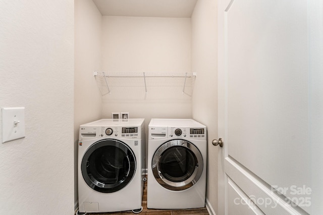 clothes washing area with laundry area and independent washer and dryer