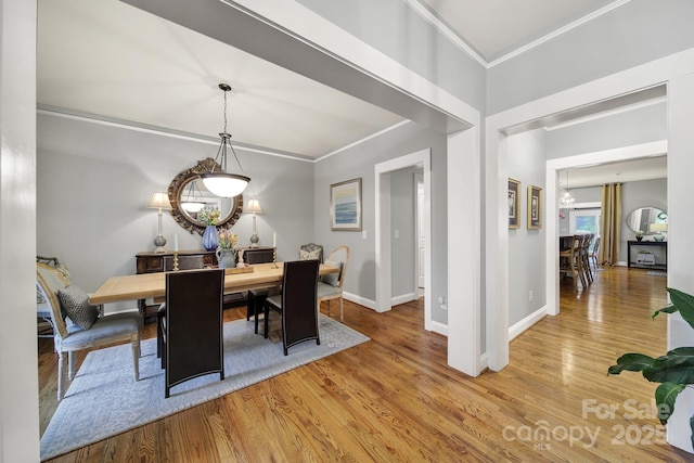 3426 Richards Xing, Fort Mill, SC 29708 - dining room with a chandelier, crown molding, wood finished floors, and baseboards