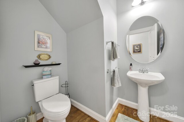 3426 Richards Xing, Fort Mill, SC 29708 - bathroom featuring wood finished floors, toilet, baseboards, and vaulted ceiling