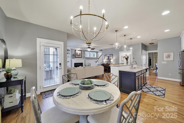 3426 Richards Xing, Fort Mill, SC 29708 - dining area featuring a chandelier, baseboards, light wood-style flooring, and recessed lighting