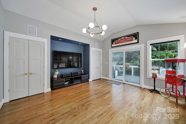 3426 Richards Xing, Fort Mill, SC 29708 - living room featuring a chandelier, light wood-style floors, vaulted ceiling, and baseboards